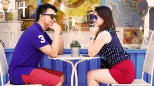 two-nice-folks-at-table-on-date-wearing-matching-clothes